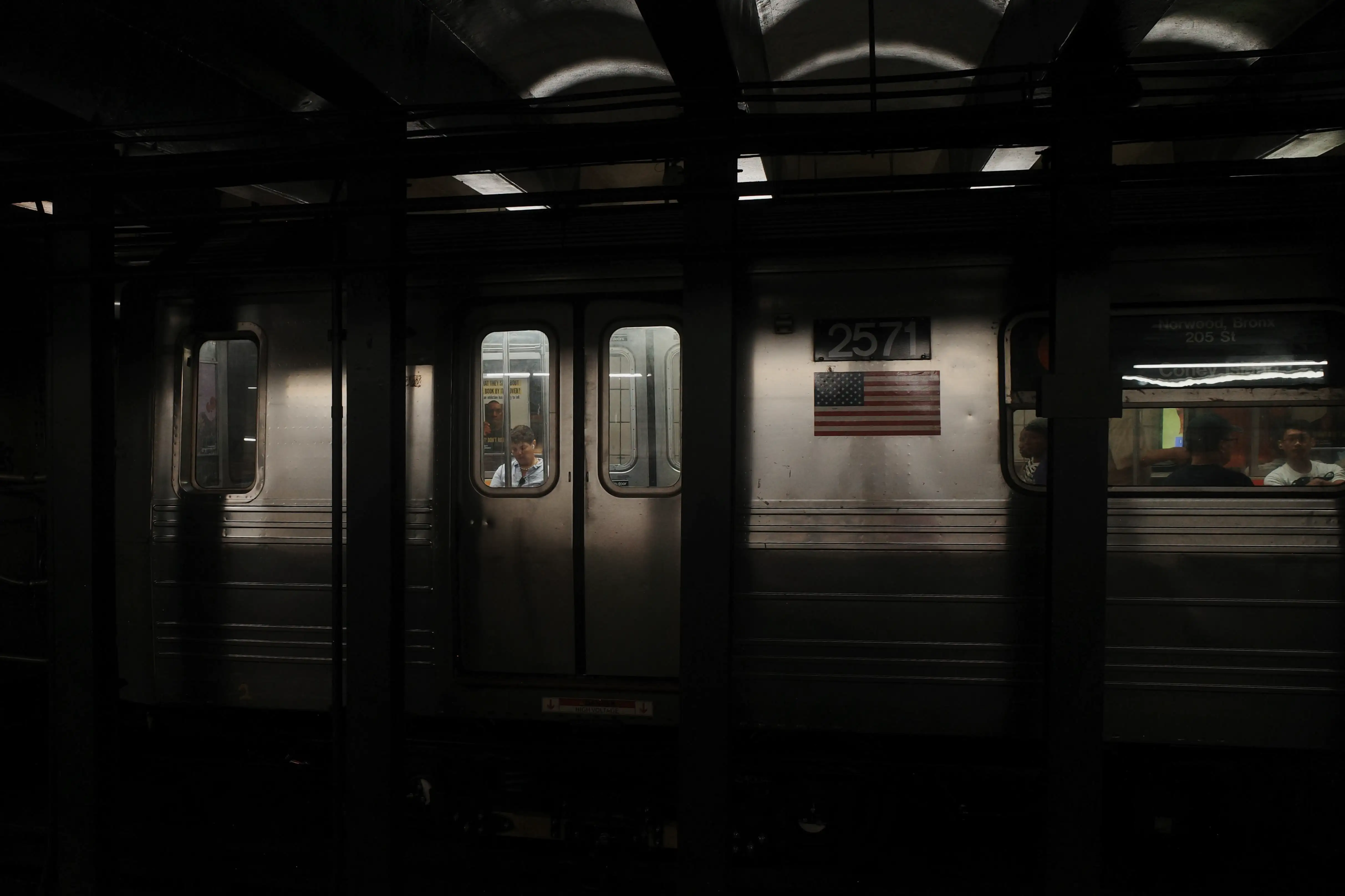 An empty New York City subway car at night